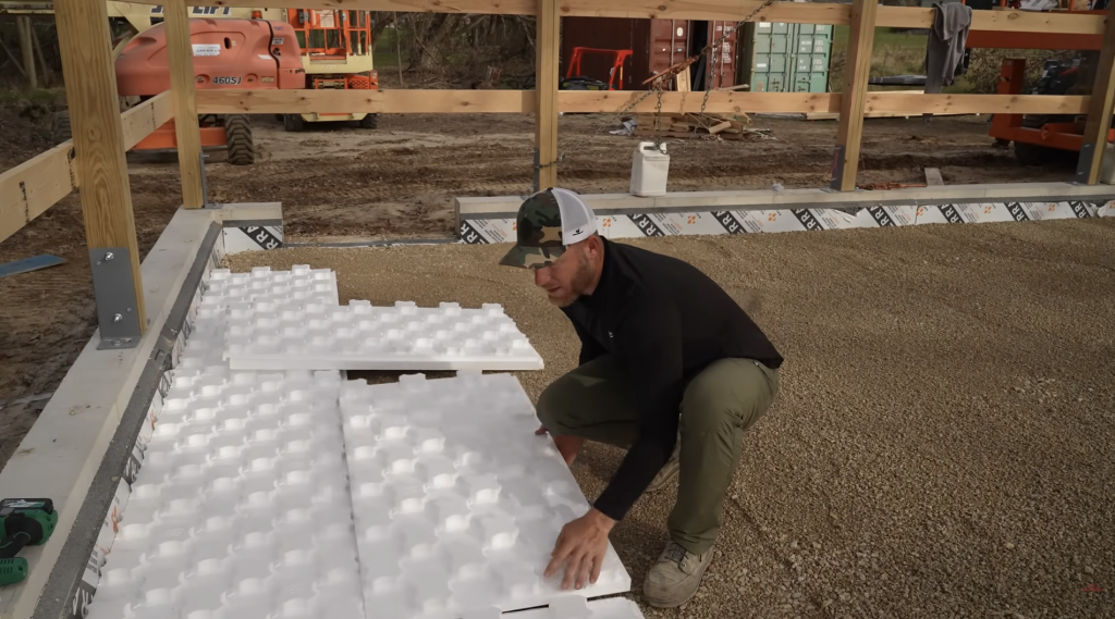Man laying Heat Sheet Heavy panels
