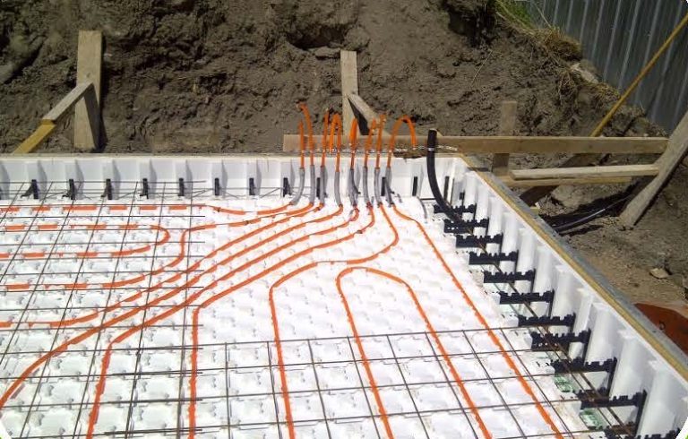 Insulated slab on grade with Heat Sheet panels and Pex piping installed.