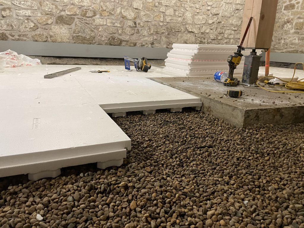 Inverted Heat-Sheet® R10 panels form built-in venting channels for radon diffusion — with the added strength and insulation to support serious slab loads.